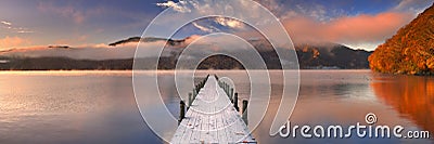 Jetty in Lake Chuzenji, Japan at sunrise in autumn Stock Photo